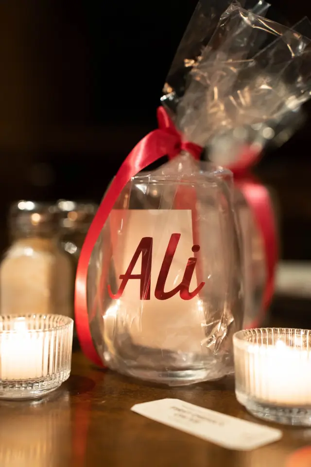 Holiday party place card and candles on the table